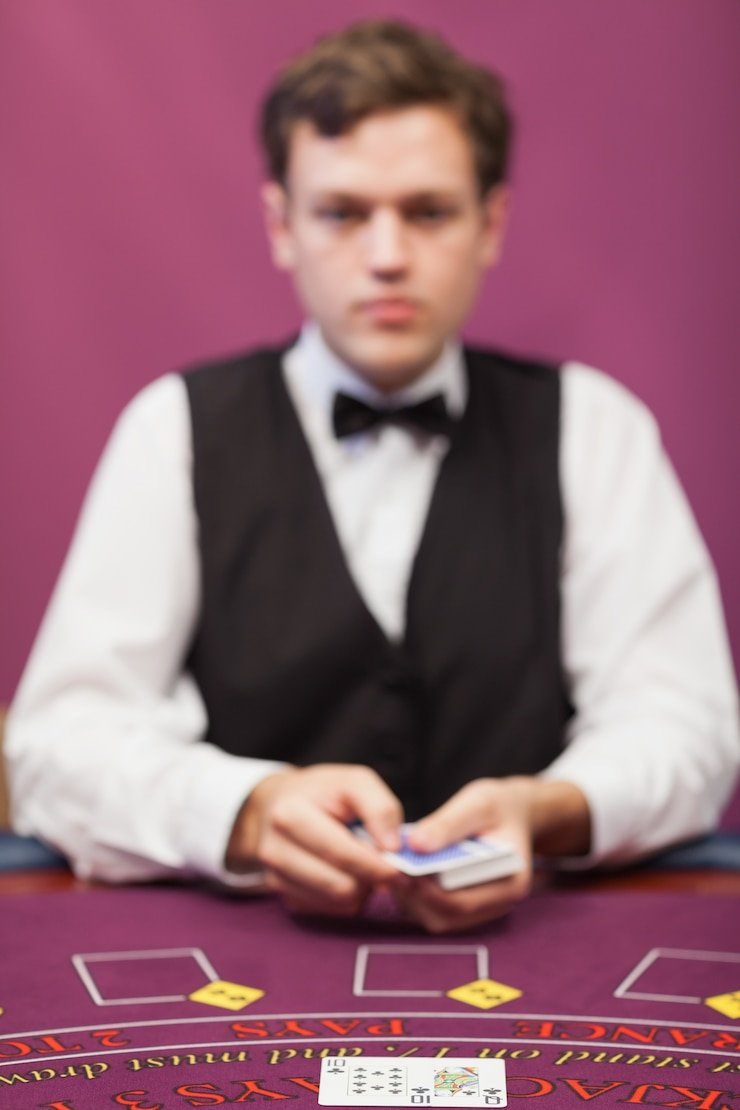Professional dealer hosting live casino game with real equipment