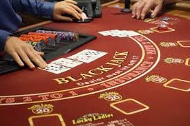 Mobile device displaying blackjack game interface for Bangladesh players